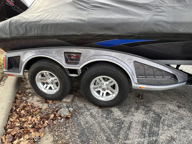 Slide: The Image of 2023 Ranger Z520R boat trailer with dual wheels and protective cover. - 22