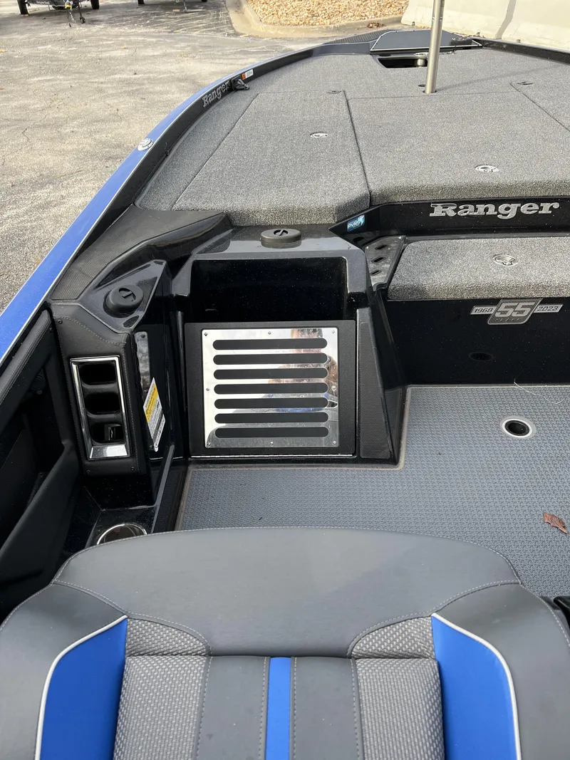 Slide: The Image of 2023 Ranger Z520R boat interior with seating and storage compartments. - 7