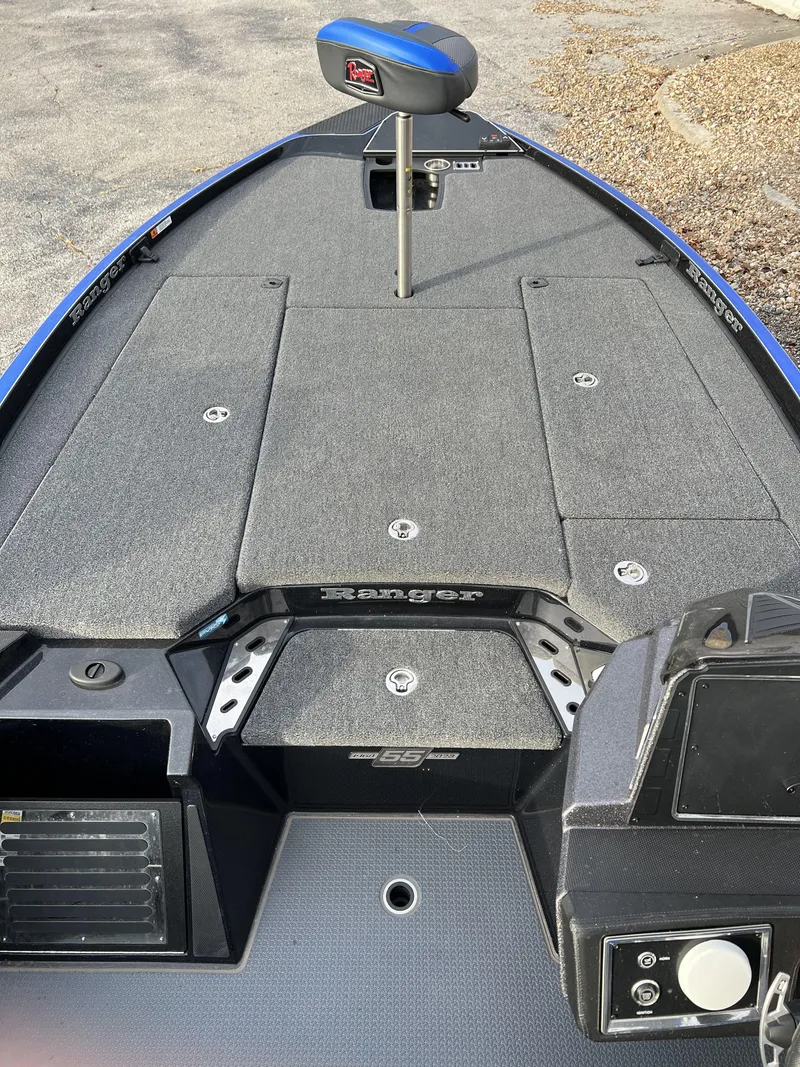 Slide: The Image of 2023 Ranger Z520R boat deck with storage compartments and seating. - 8
