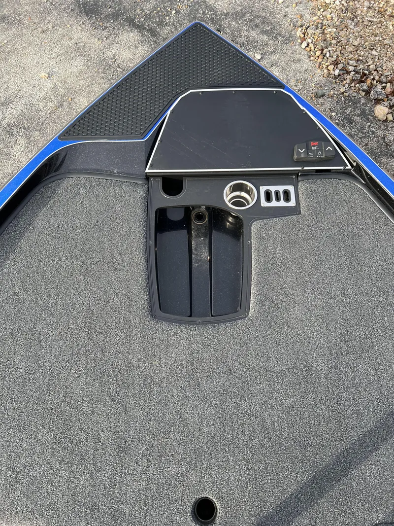 Slide: The Image of 2023 Ranger Z520R boat deck with control panel and storage compartments. - 9