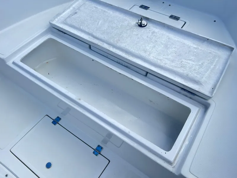 Slide: The Image of Clearwater 2000 boat storage compartments, 2022 model, open and empty. - 14