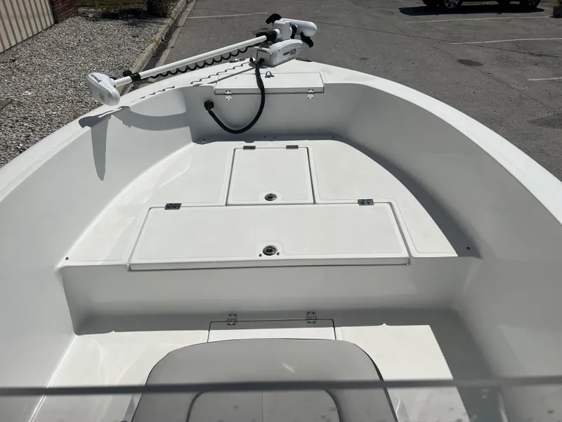 Slide: The Image of Clearwater 2000 boat, 2022 model, featuring a spacious deck and trolling motor. - 17