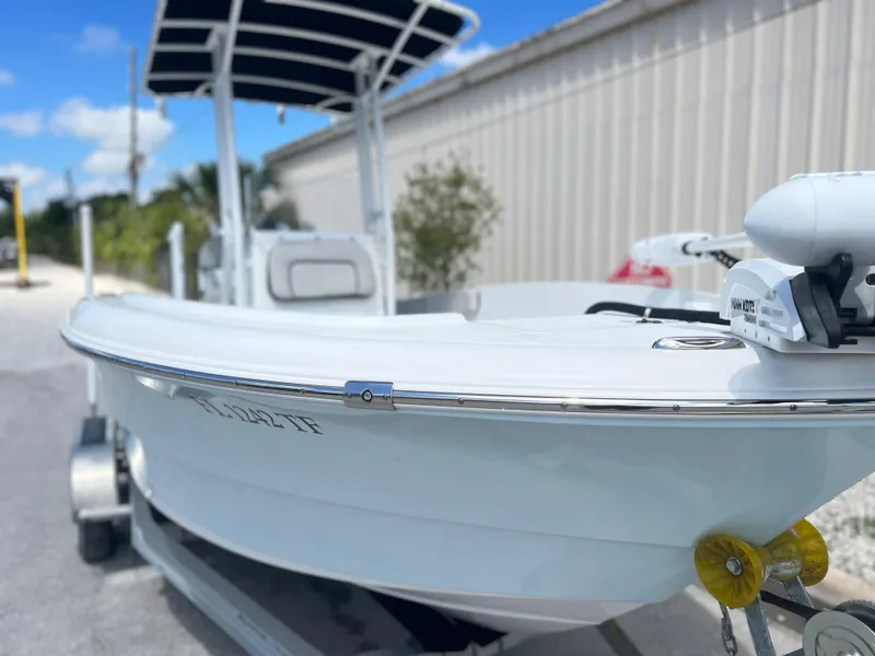 Slide: The Image of Clearwater 2000 boat, 2022 model, on a trailer with a blue sky background. - 3