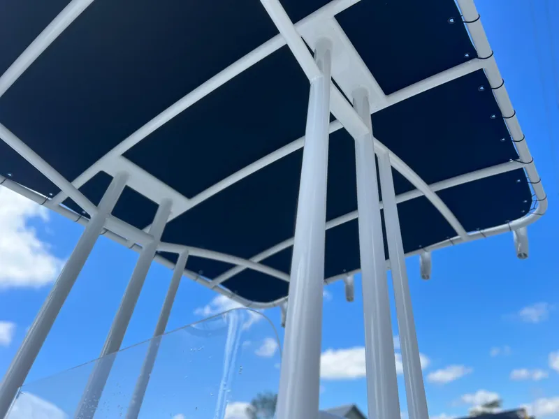 Slide: The Image of Clearwater 2000 boat canopy, 2022 model, under a clear blue sky. - 9