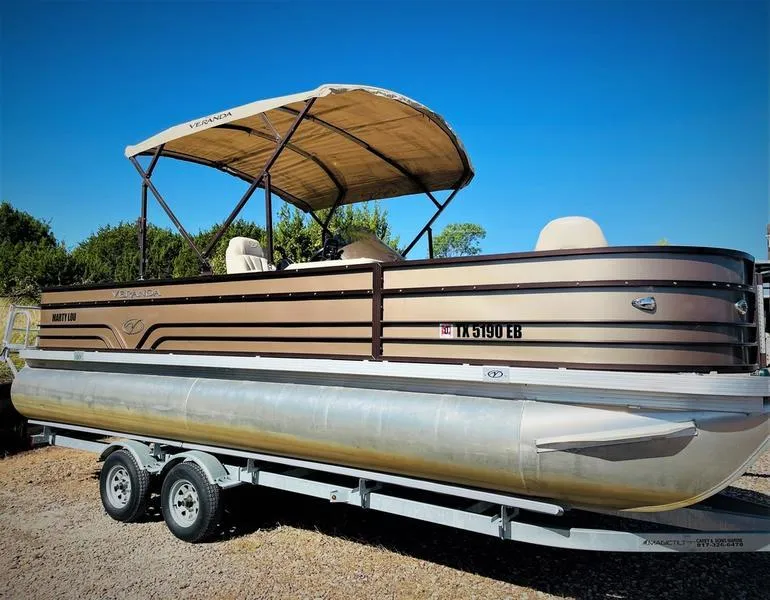 Slide: The Image of 2015 Veranda VF2275F4 pontoon boat on a trailer with canopy. - 0
