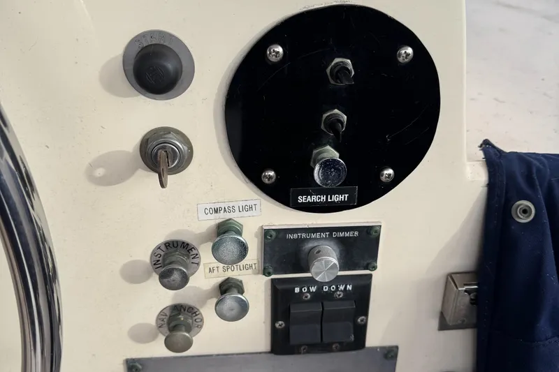 Slide: The Image of Control panel of a 1978 Hatteras 58 MY yacht with searchlight and instrument dimmer. - 16