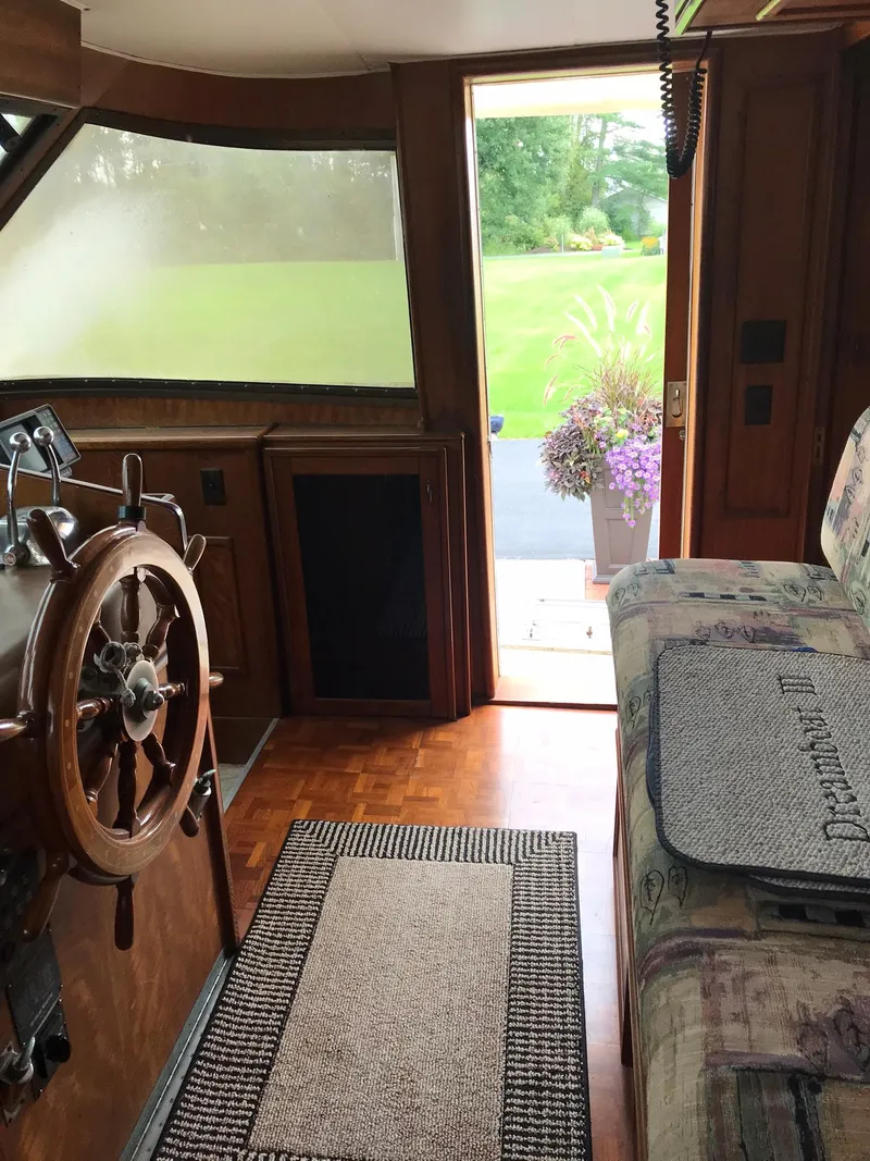 Slide: The Image of Interior of a 1978 Hatteras 58 MY yacht with wooden helm and open door. - 20