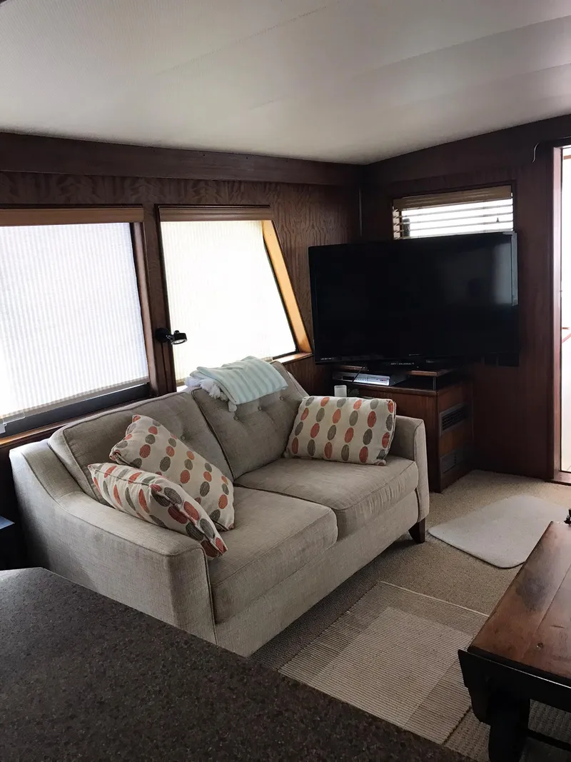 Slide: The Image of 1978 Hatteras 58 MY yacht interior with cozy seating and large TV. - 27