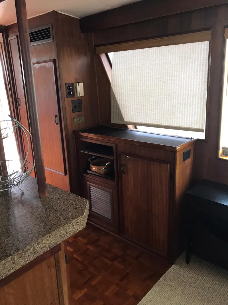 Slide: The Image of Interior of 1978 Hatteras 58 MY yacht with wooden cabinetry and countertop. - 32