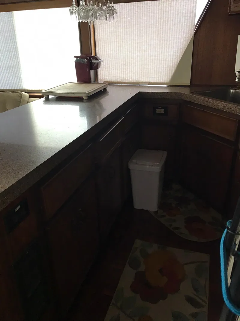 Slide: The Image of 1978 Hatteras 58 MY yacht kitchen with wooden cabinets and countertops. - 36