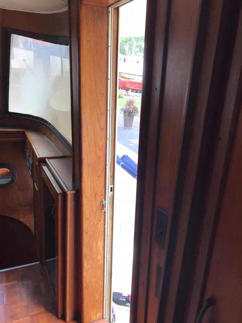 Slide: The Image of Interior view of 1978 Hatteras 58 MY yacht with wooden paneling. - 42