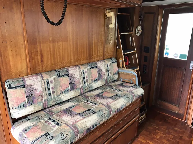 Slide: The Image of 1978 Hatteras 58 MY interior with patterned sofa and wooden decor. - 43