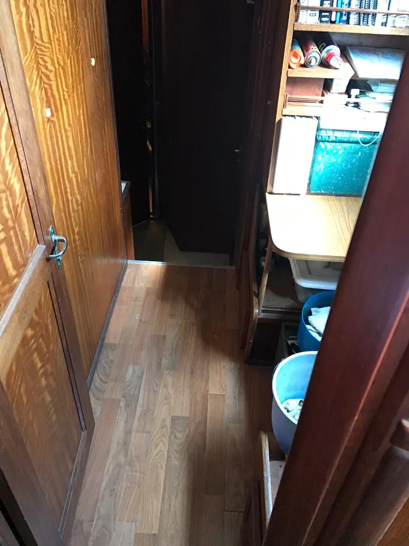 Slide: The Image of Interior hallway of a 1978 Hatteras 58 MY yacht with wooden flooring. - 48