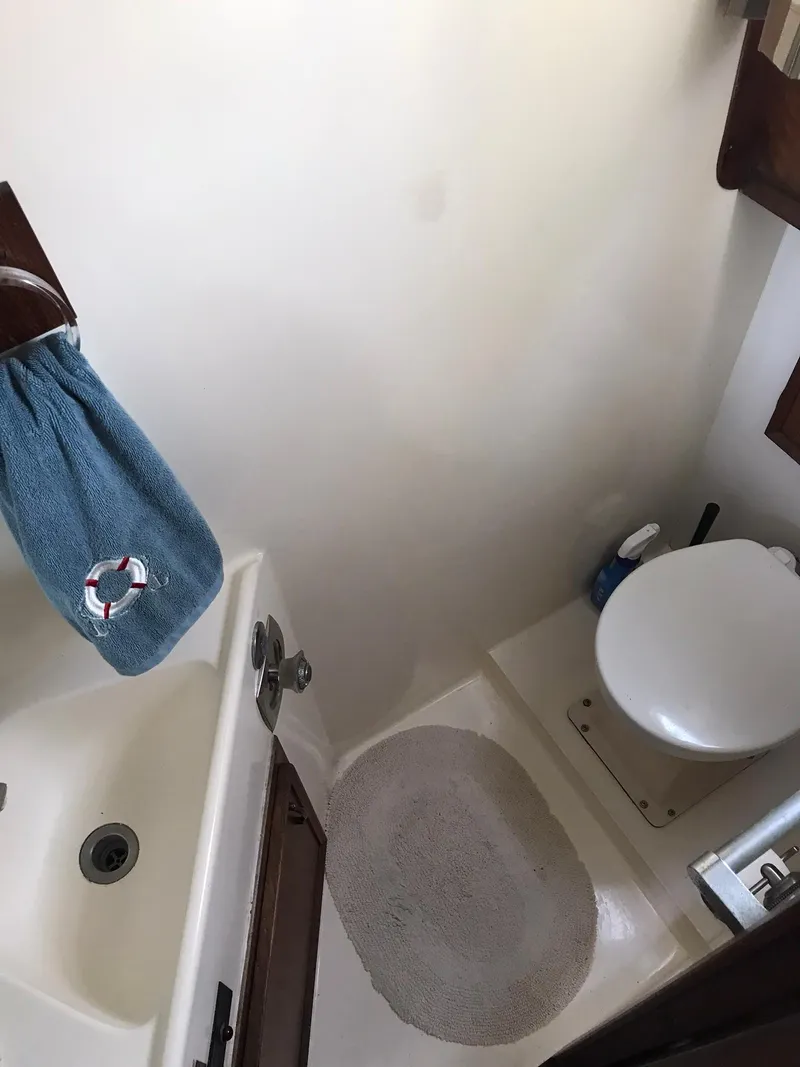 Slide: The Image of 1978 Hatteras 58 MY yacht bathroom with sink and toilet. - 53