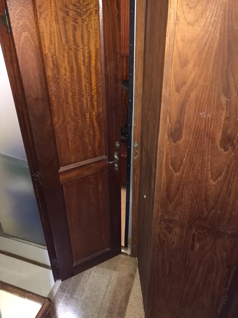 Slide: The Image of 1978 Hatteras 58 MY interior wooden door and hallway. - 57