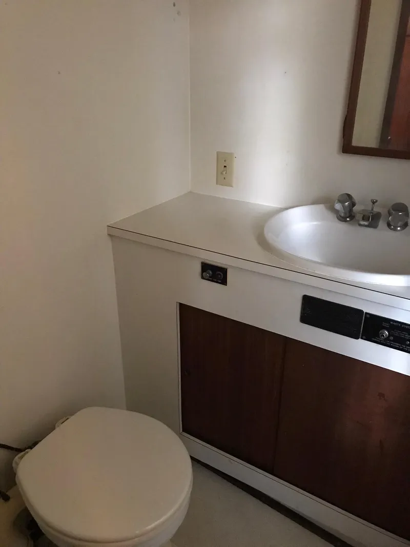 Slide: The Image of 1978 Hatteras 58 MY yacht bathroom with sink and toilet. - 61