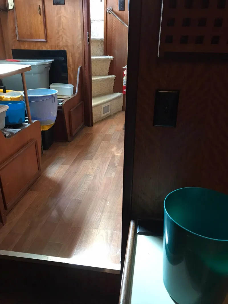 Slide: The Image of Interior of 1978 Hatteras 58 MY yacht with wooden flooring and stairs. - 62