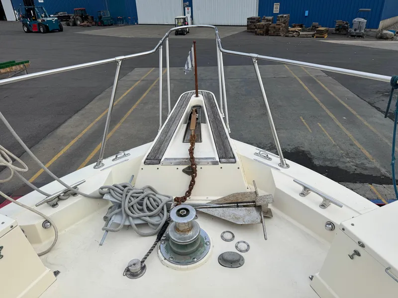 Slide: The Image of Bow of 1978 Hatteras 58 MY yacht with anchor and ropes at dock. - 9
