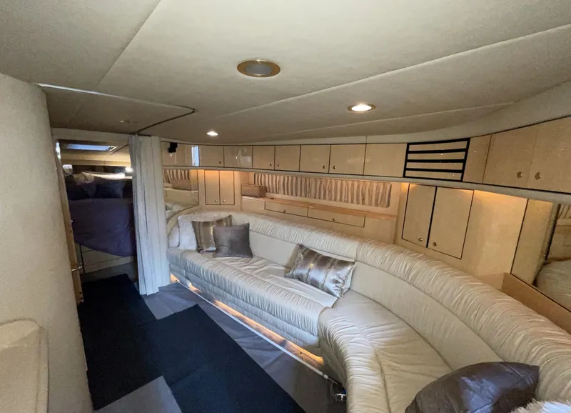 Slide: The Image of Luxurious interior of 2000 Sea Ray 540 Sundancer yacht with plush seating and ambient lighting. - 14