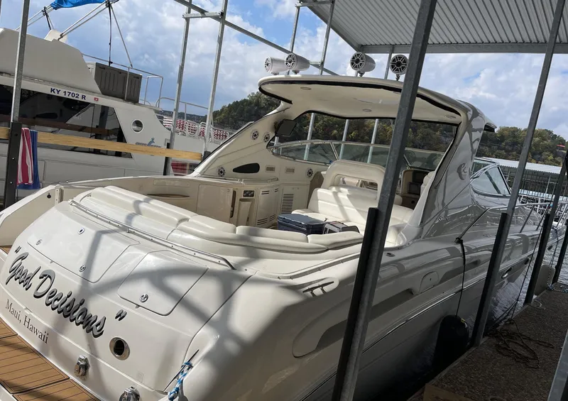 Slide: The Image of 2000 Sea Ray 540 Sundancer luxury yacht docked at marina. - 2