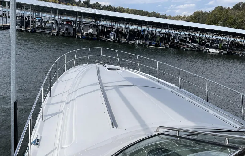 Slide: The Image of 2000 Sea Ray 540 Sundancer yacht docked at a marina. - 5