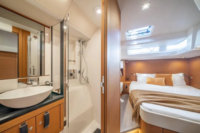 Slide: The Image of Luxurious interior of 2023 Jeanneau 65 yacht with bedroom and bathroom. - 10