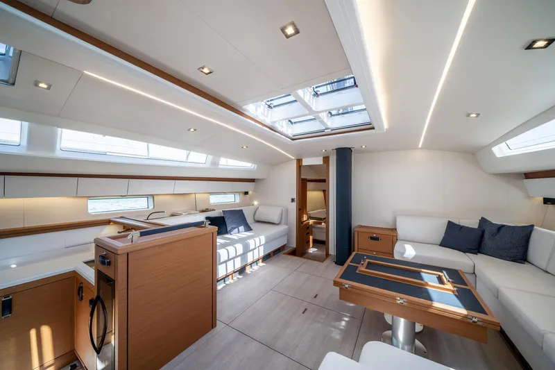 Slide: The Image of Luxurious interior of 2023 Jeanneau 65 yacht with modern design and ample natural light. - 12