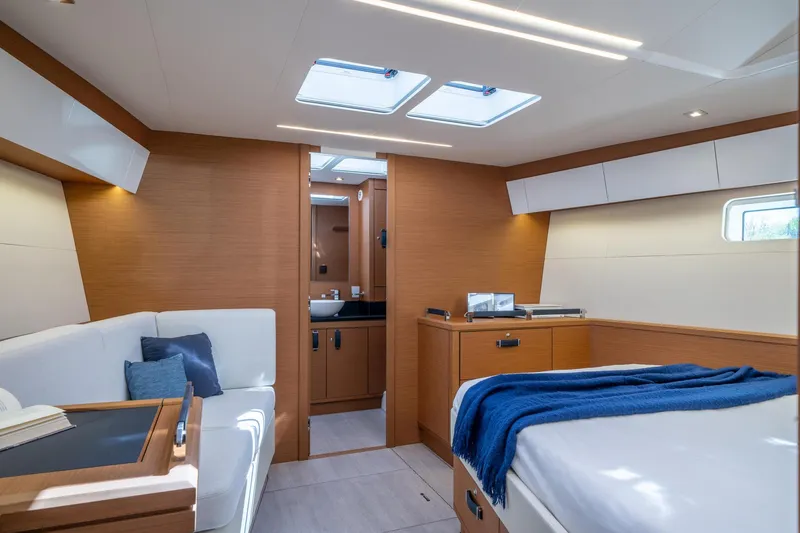 Slide: The Image of Luxurious interior of the 2023 Jeanneau 65 yacht with modern furnishings and natural light. - 13