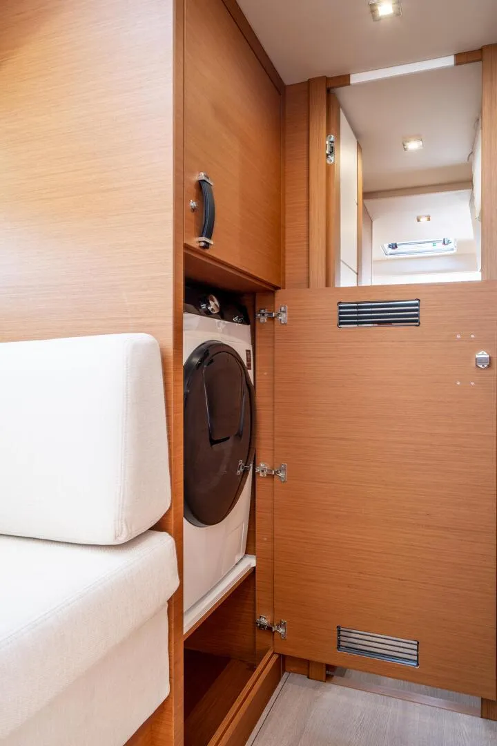 Slide: The Image of Interior of 2023 Jeanneau 65 yacht with built-in washing machine. - 16