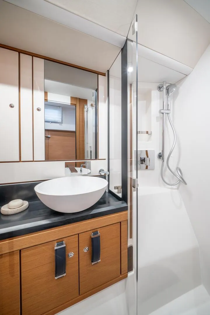 Slide: The Image of Modern bathroom in 2023 Jeanneau 65 yacht with sleek design and glass shower. - 19
