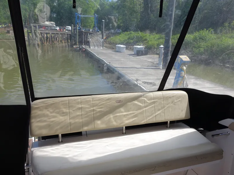 Slide: The Image of 2011 Regal 35 Express Cruiser interior with dock view through window. - 10