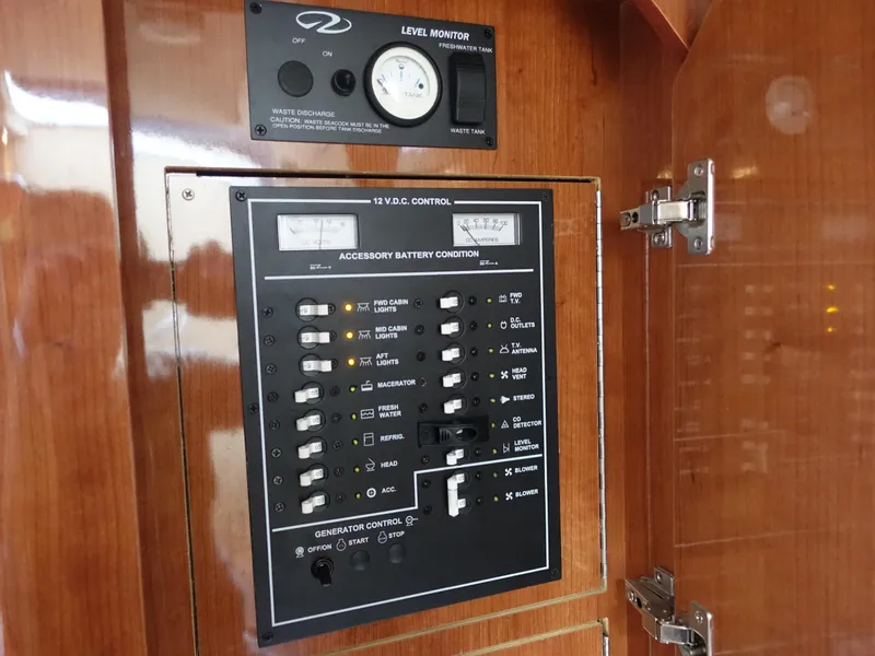 Slide: The Image of Electrical control panel on 2011 Regal 35 Express Cruiser boat. - 19