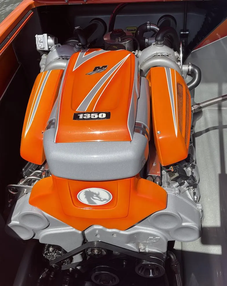 Slide: The Image of 2017 Nordic 43' Enforcer boat engine with orange and silver detailing. - 15