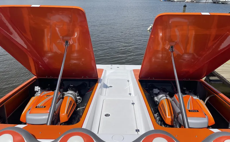 Slide: The Image of 2017 Nordic 43' Enforcer boat with open engine compartments, docked by the water. - 16