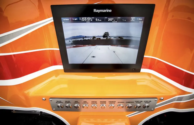 Slide: The Image of Raymarine display on 2017 Nordic 43' Enforcer boat dashboard with vibrant orange design. - 27