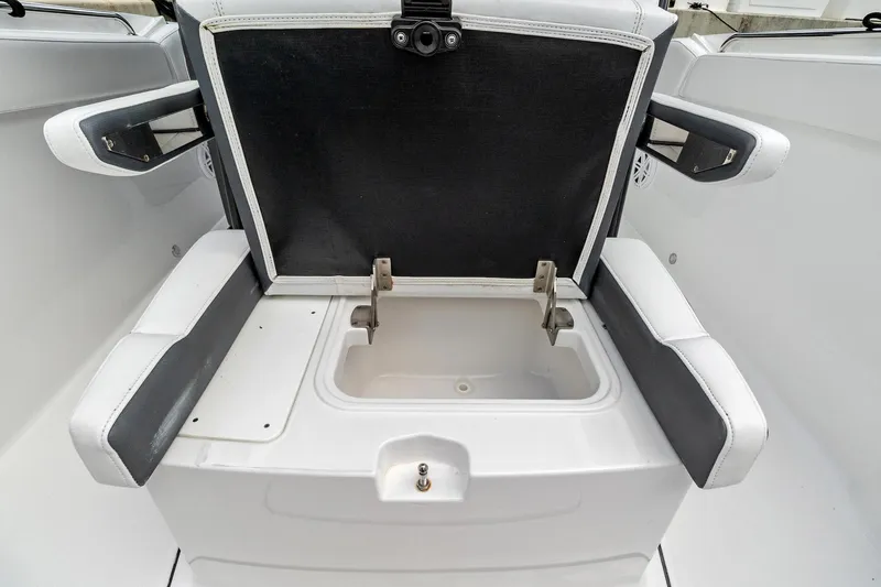 Slide: The Image of 2022 Blackfin 272 CC boat with open storage compartment. - 10