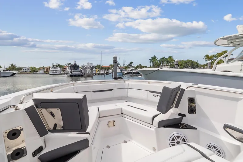 Slide: The Image of 2022 Blackfin 272 CC boat interior with seating at marina. - 7