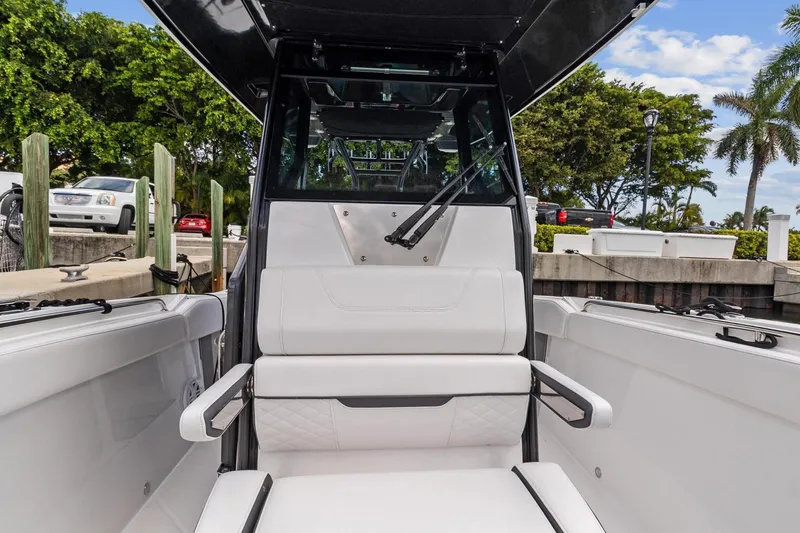 Slide: The Image of 2022 Blackfin 272 CC boat interior with white seating and modern design. - 9