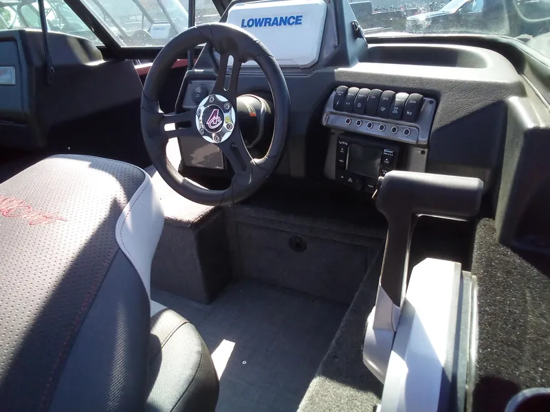 Slide: The Image of 2023 Alumacraft Competitor 175 Sport boat interior with steering wheel and control panel. - 3