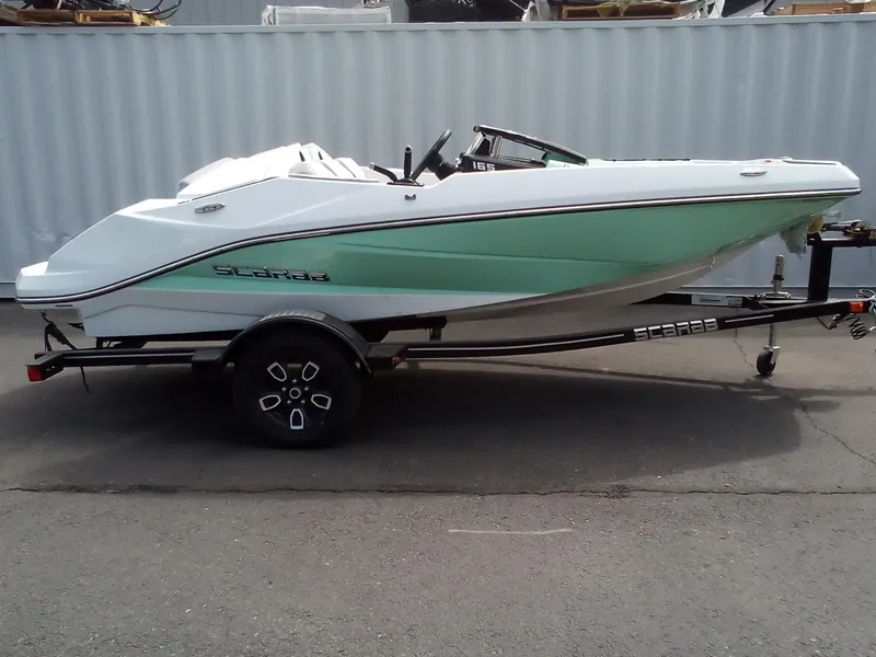 Slide: The Image of 2023 Scarab 165 ID boat on trailer, side view. - 1