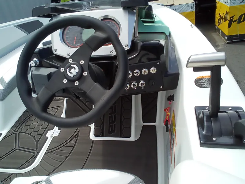 Slide: The Image of 2023 Scarab 165 ID boat dashboard and steering wheel. - 4