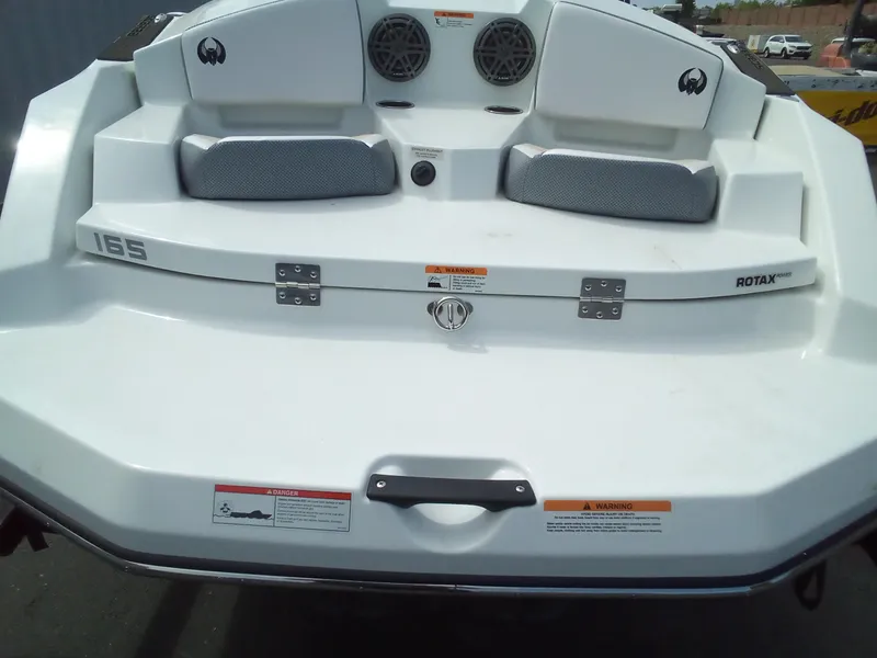 Slide: The Image of 2023 Scarab 165 ID boat rear view with seating and speakers. - 5