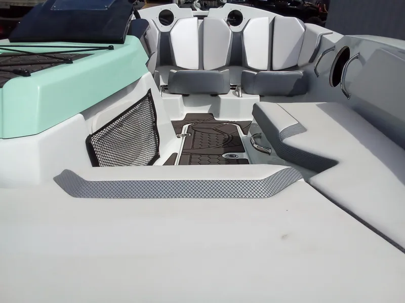 Slide: The Image of 2023 Scarab 165 ID boat interior with seating and storage compartments. - 7