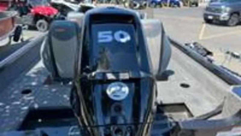 Slide: The Image of 2022 Alumacraft Classic 165 CS boat with a 50 HP outboard motor. - 2