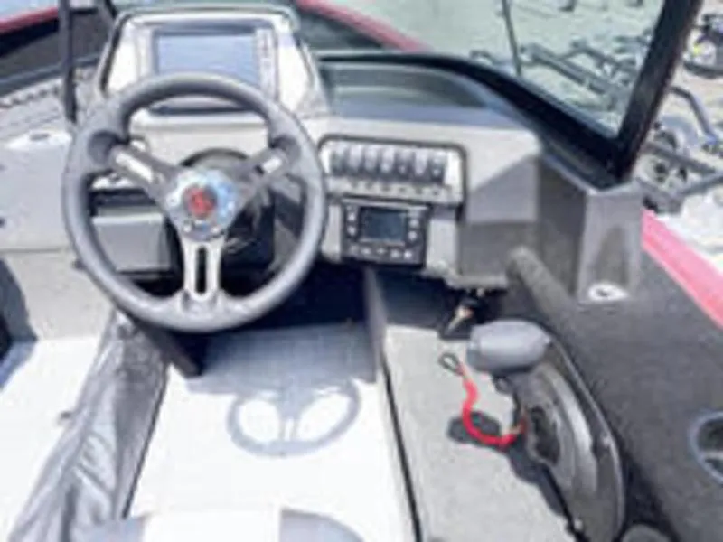 Slide: The Image of 2022 Alumacraft Competitor 205 Sport boat dashboard and steering wheel. - 11
