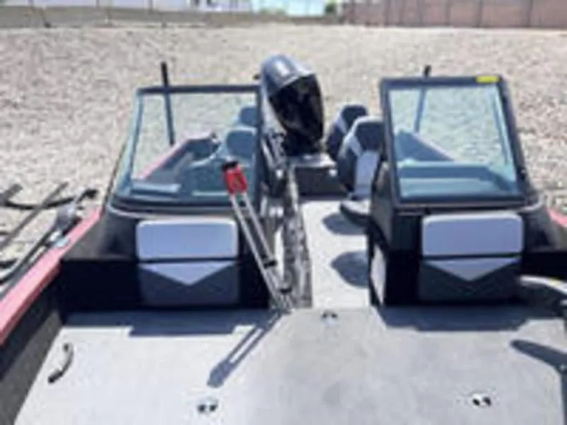 Slide: The Image of 2022 Alumacraft Competitor 205 Sport boat with dual consoles and outboard motor. - 7