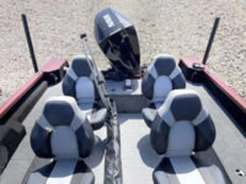 Slide: The Image of 2022 Alumacraft Competitor 205 Sport boat interior with four seats and outboard motor. - 9