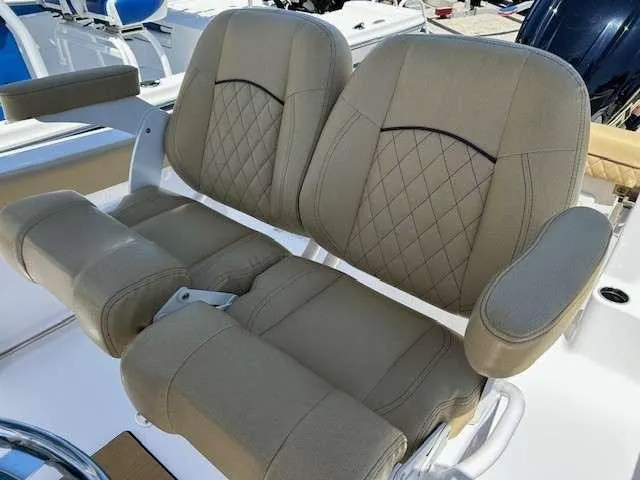Slide: The Image of 2023 Sportsman 232 Open boat seats with diamond-stitched upholstery and armrests. - 3