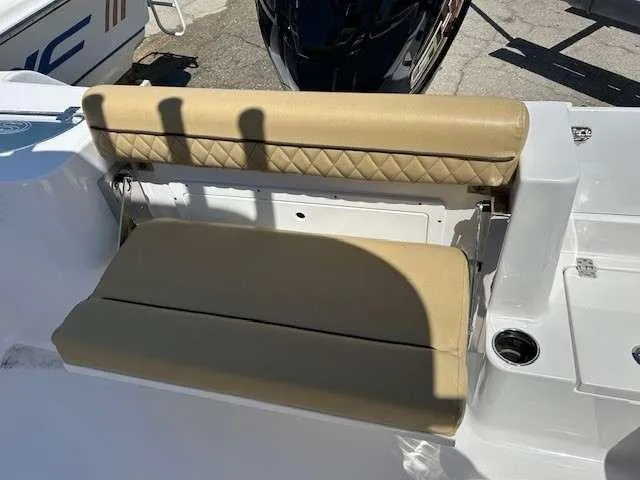 Slide: The Image of 2023 Sportsman 232 Open boat seat with tan upholstery and cup holder. - 8