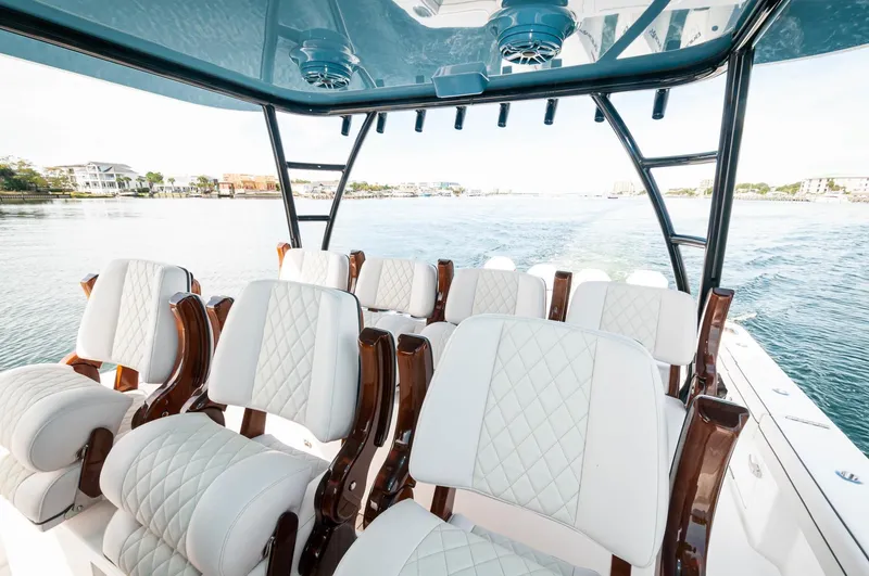 Slide: The Image of 2022 Valhalla Boatworks V46 Center Console with luxurious seating on open water. - 14